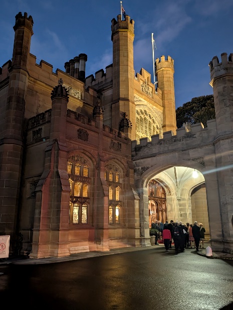 A group of people walking in front of a castle AI-generated content may be incorrect.